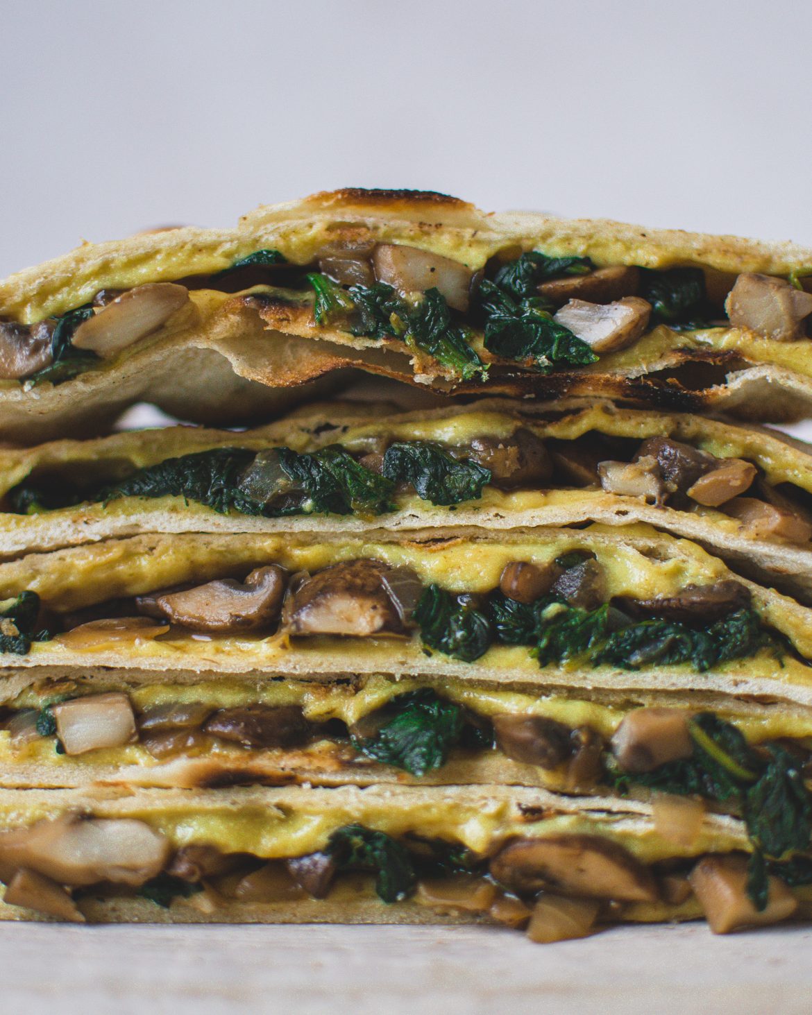 This vegan quesadilla recipe is easy to make, plant-based, and dairy-free. You can eat those savoury quesadillas as main dish or finger food. Filled with spinach, mushrooms and vegan cheese, they are full of flavour and filling. #veganquesadillas #quesadillas #vegandinner