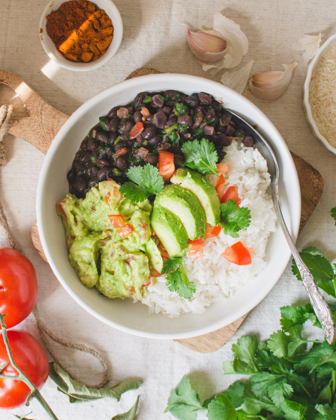This vegan burrito bowl is simple, healthy, and so delicious! The recipe consists of rice, spicy black beans with coriander and fresh guacamole. It's a quick, plant-based Mexican recipe that's perfect for lunch or dinner! #vegan #burritobowl #veganburritobowl #veganrecipes #veganlunchideas #veganrecipeideas